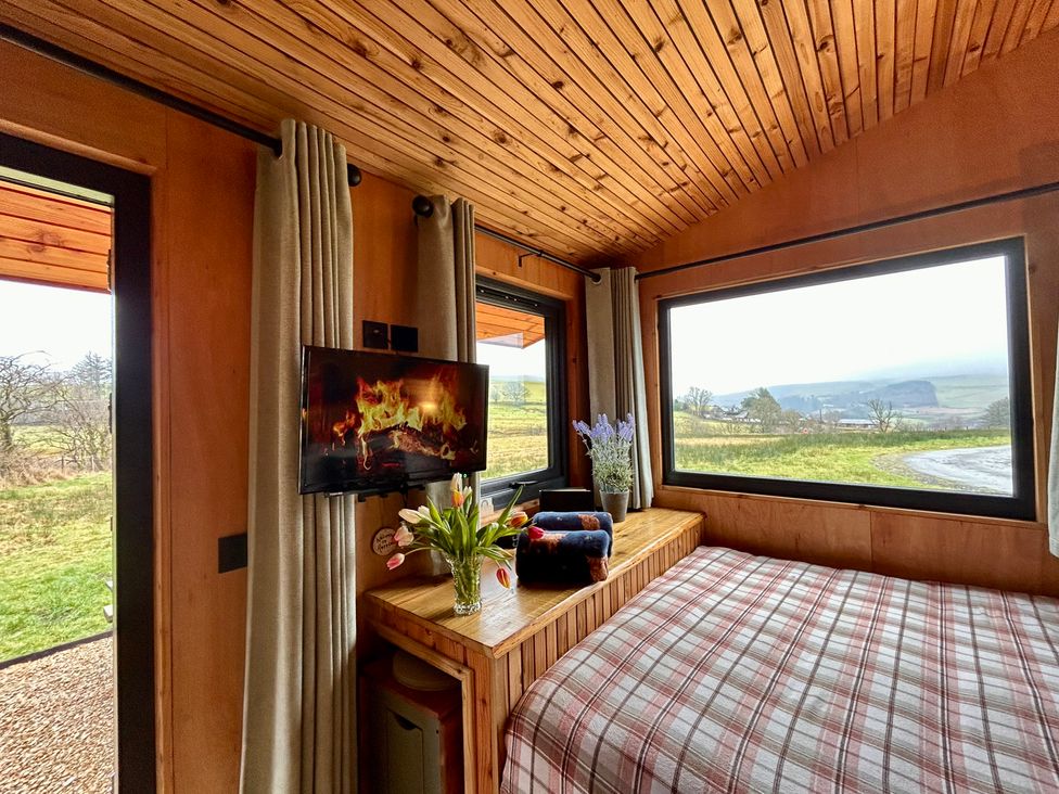 A bedroom with a bed and TV at Harriet in Llangurig