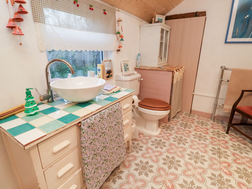 A bathroom with a sink and toilet at The Hare & the Bumblebee Cottage