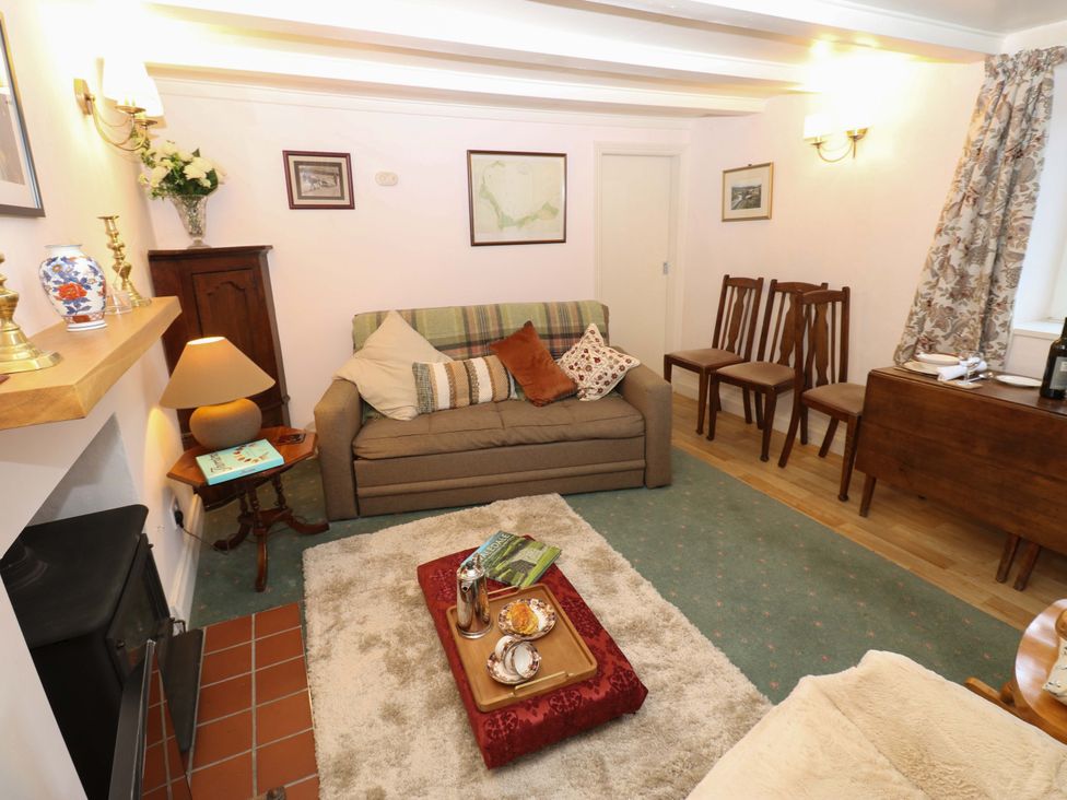 A living room with a sofa and coffee table at Wain Wath Cottage in Richmond