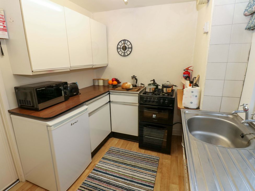 A kitchen with appliances and cooking equipment at Wain Wath Cottage in Richmond