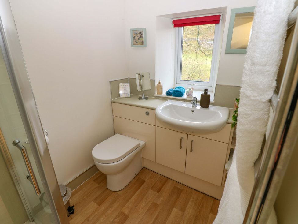 A bathroom with a sink and toilet at Wain Wath Cottage in Richmond