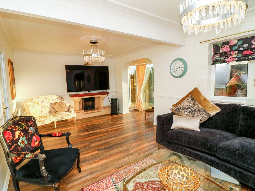 A living room with a fireplace and furniture at 12 Wyndham Road Loughborough