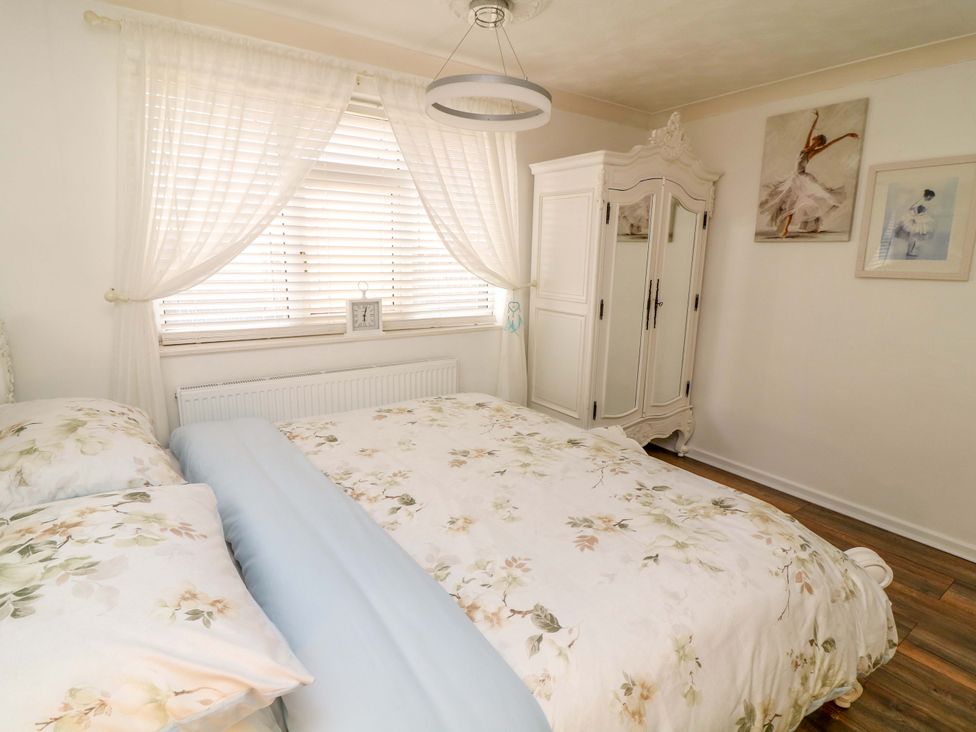 A bedroom with a bed and wardrobe at 12 Wyndham Road in Loughborough