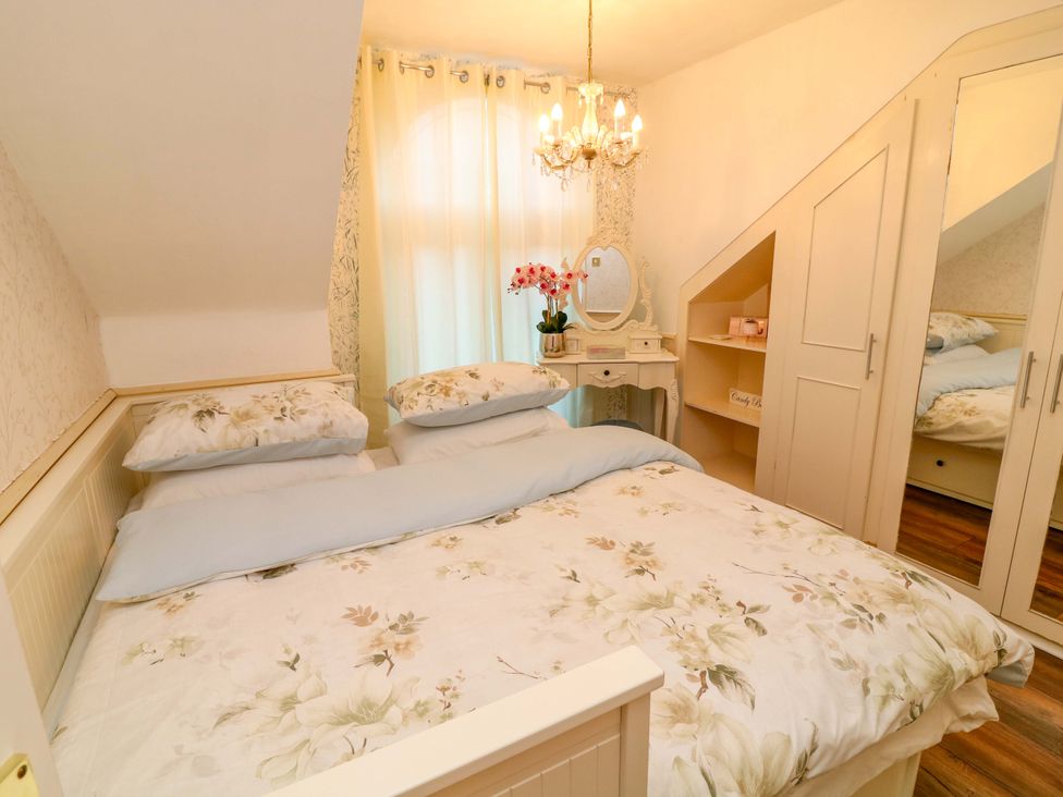 A bedroom with a bed and dresser at 12 Wyndham Road Loughborough