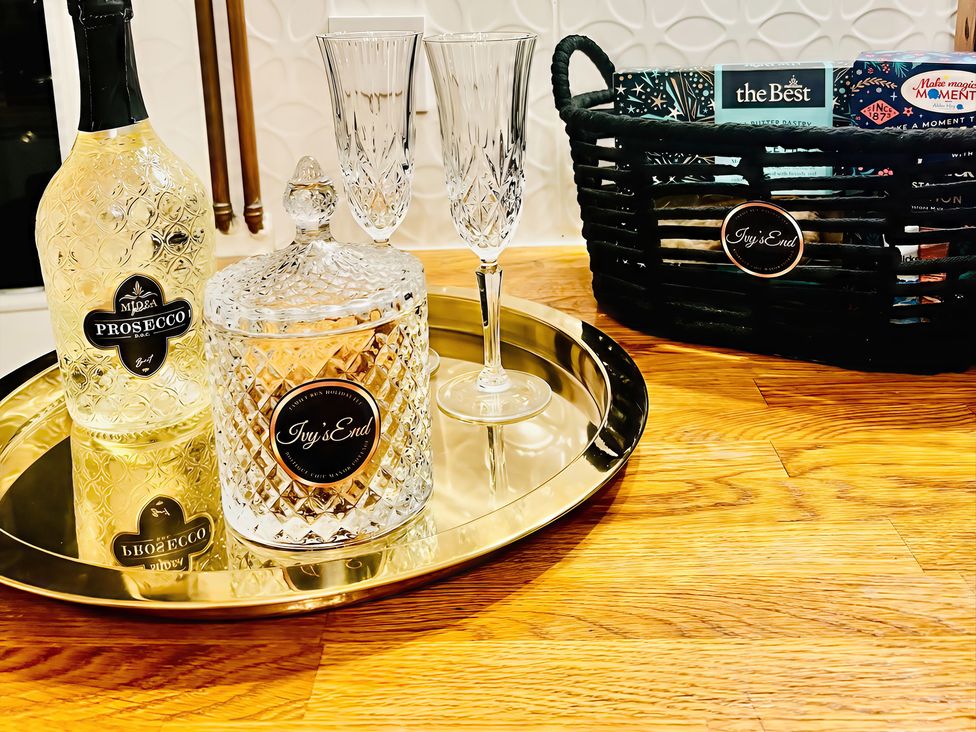 A bottle of prosecco and glasses on a tray at Ivy's End in Loughborough