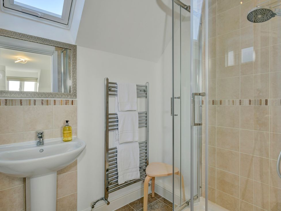 A bathroom with a sink and shower at The Old Boat House in Lyme Regis