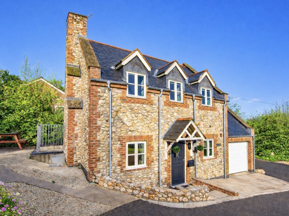 A house with a garden and pathway at The Old Boat House in Lyme Regis