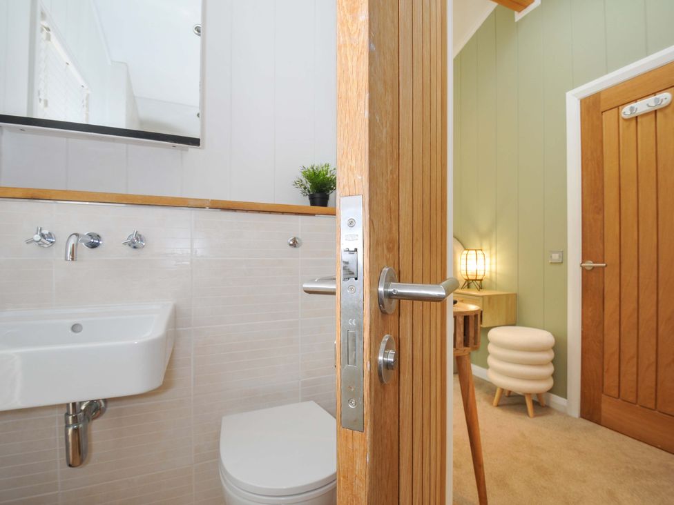 A bathroom with a sink and toilet at 6 Stonerush Valley Looe