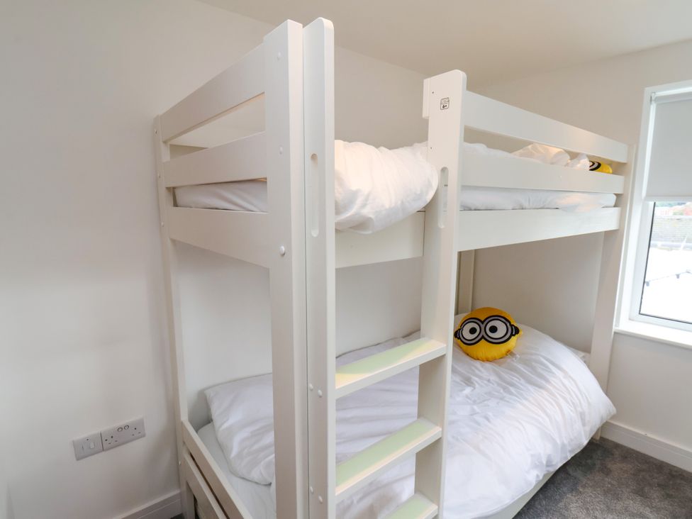 A bedroom with a bunk bed and a stuffed toy at OG's House in Whitby