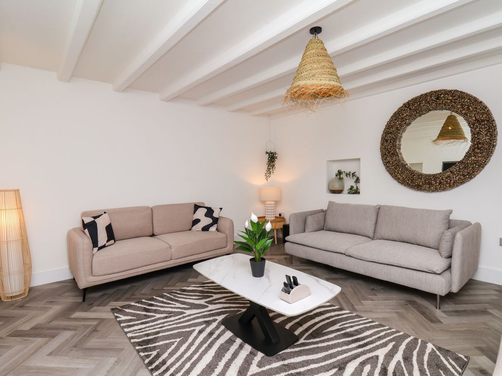 A living room with two sofas and a coffee table at Og's House in Whitby