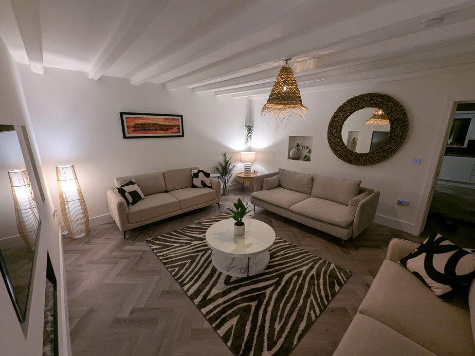 A living room with sofas and a coffee table at Og's House in Whitby