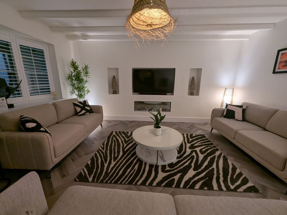 A living room with two couches and a coffee table at Og's House in Whitby