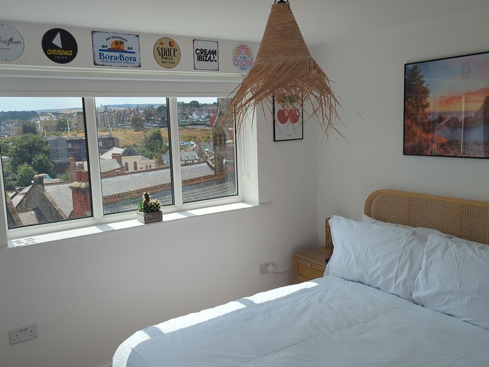 A bedroom with a bed and window at Og's House in Whitby