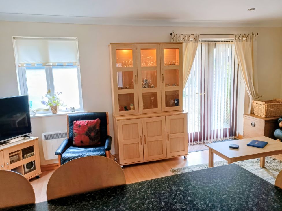A living room with a television and shelf cabinet at 29 Pendra Loweth Falmouth