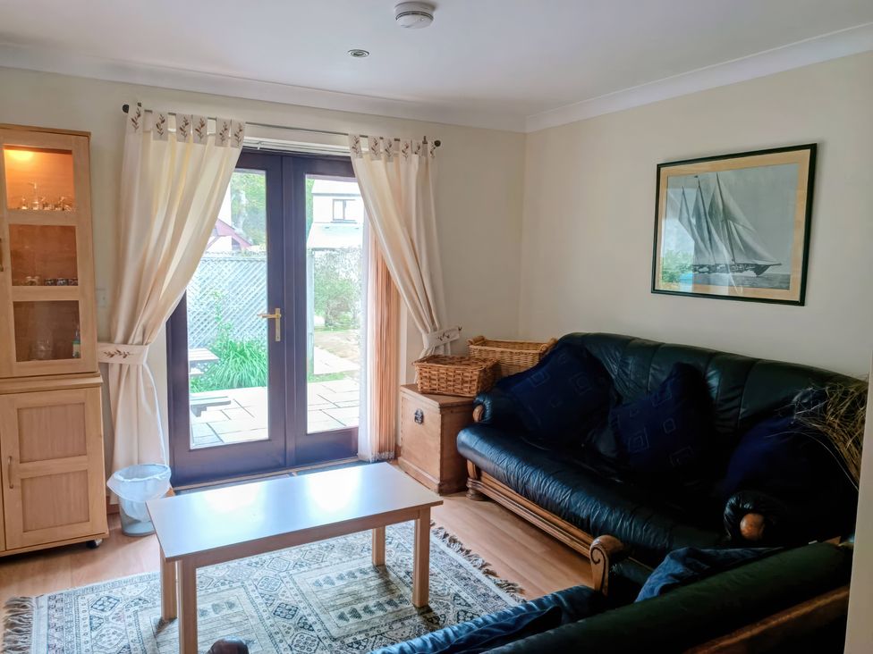 A living room with a sofa and coffee table at 29 Pendra Loweth in Falmouth