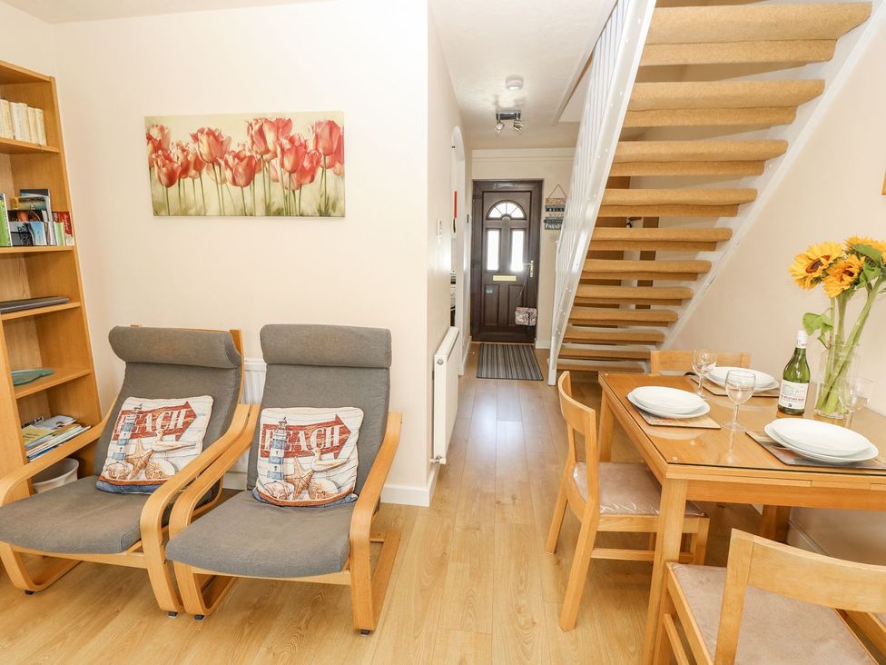 A dining room with chairs and a table at Poole Quay Cottage in Poole