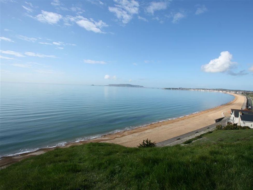 A beach view with sea and sand at Old Harbour View in Weymouth