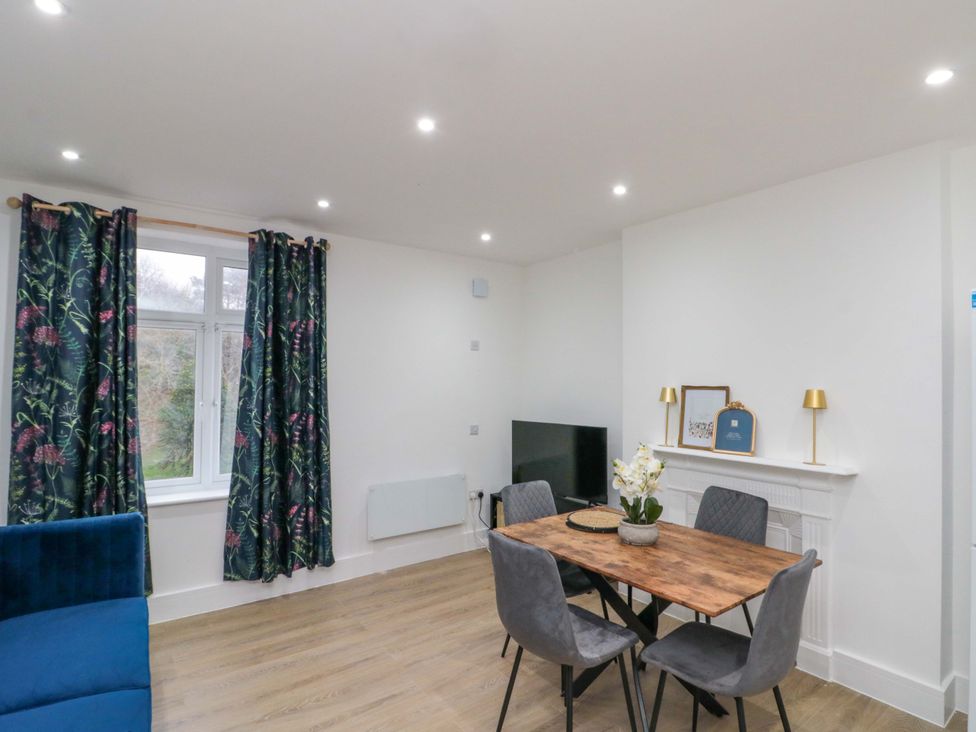 A dining room with a table and chairs at Beachwalk Villa 2 in Whitby