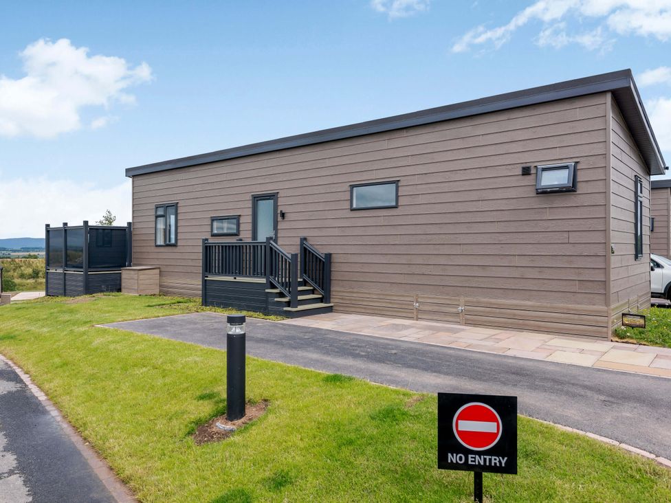 A mobile home with a wooden deck and no entry sign at Blencathra Family Penrith