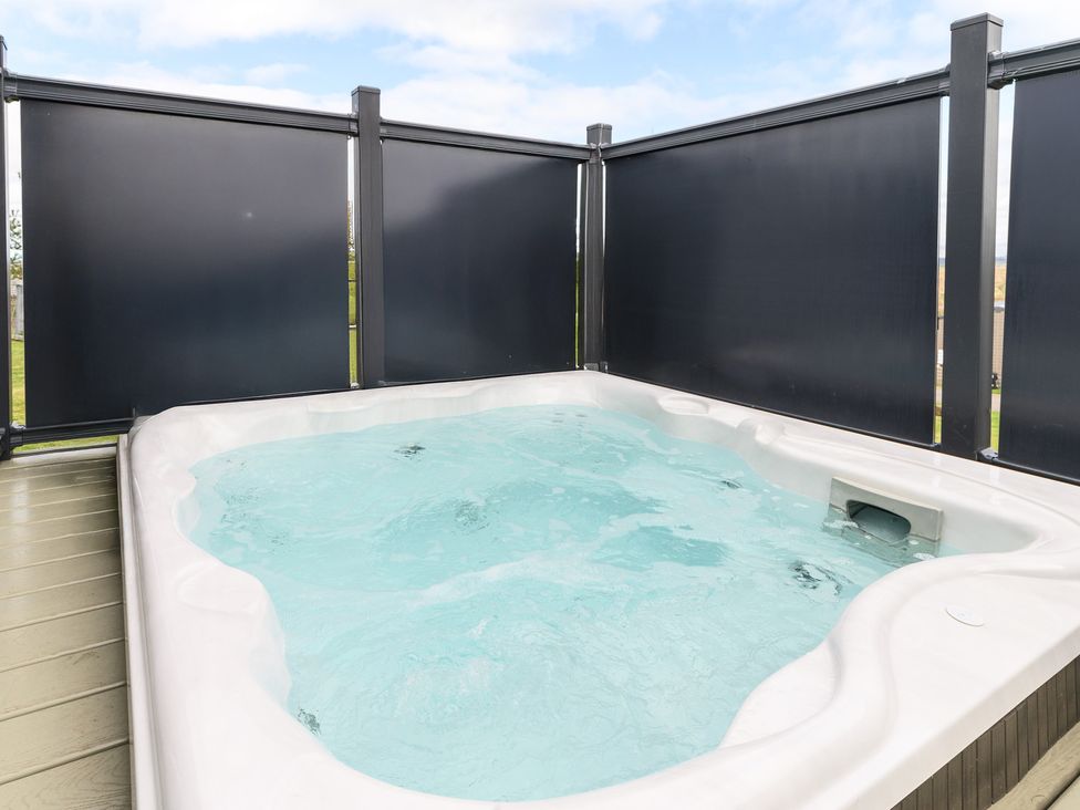 A hot tub in an outdoor area at Blencathra Family (Pet) in Penrith