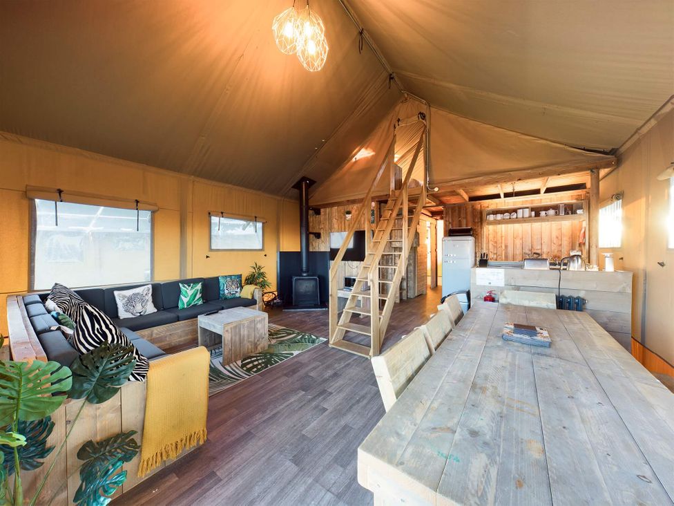 A living area with sofa and kitchen facilities at Savannah (Pet) Penrith