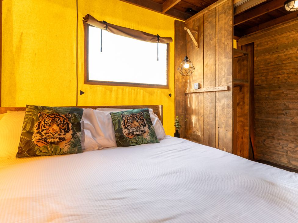 A bedroom with a bed and window at Kruger in Penrith