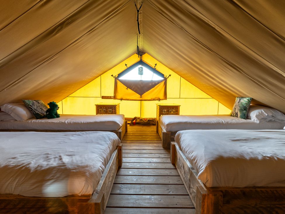 A bedroom with beds and a window in a tent at Kruger in Penrith