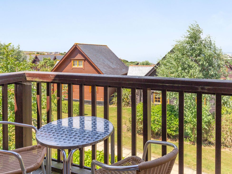 A balcony with a table and chairs at Scandinavian Lodge 4 in Portreath