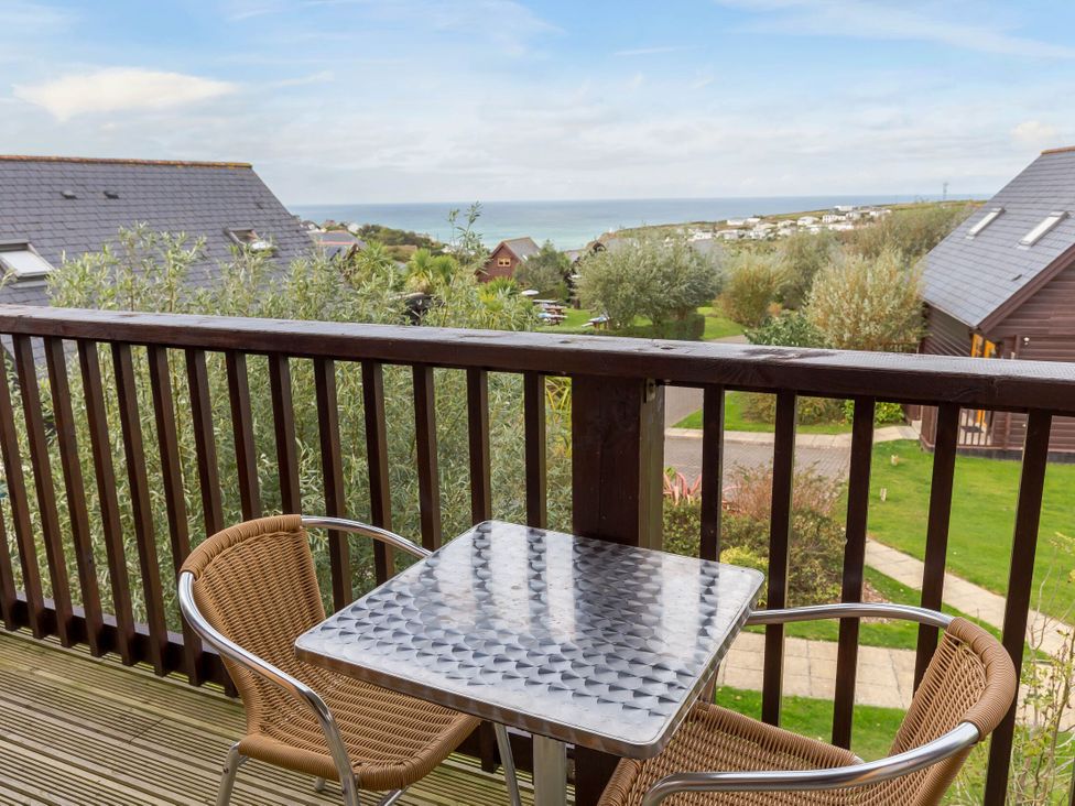 A balcony with a table and chairs at Scandinavian Lodge 6 in Portreath