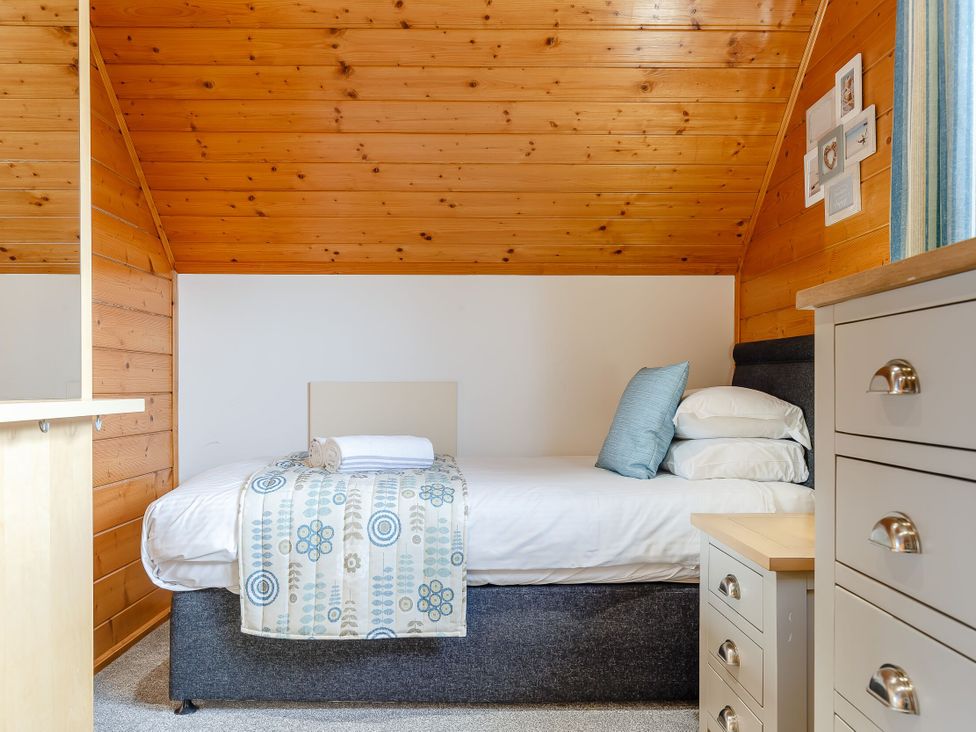 A bedroom with a bed and a drawer unit at Scandinavian Assisted Living in Portreath