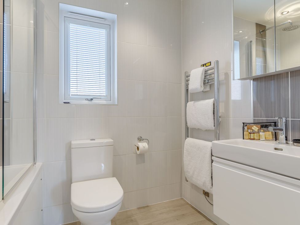 A bathroom with a toilet, sink and shower at Signature Lodge Pet 6 in Portreath