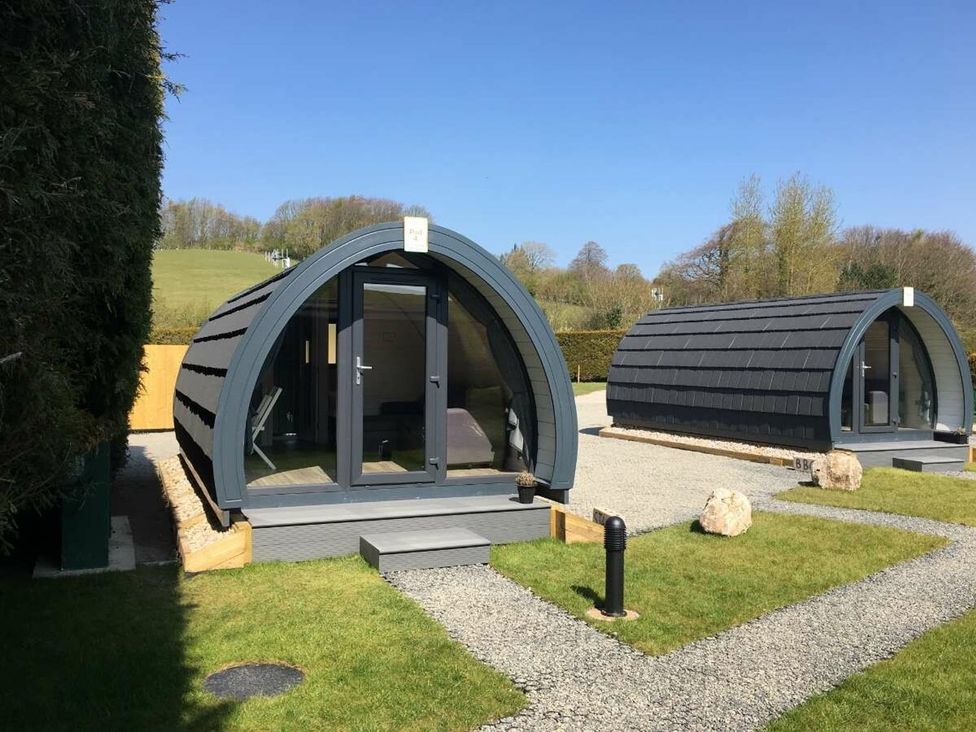 Two pods in an outdoor area at Pod 3 (No Pets) Carnforth
