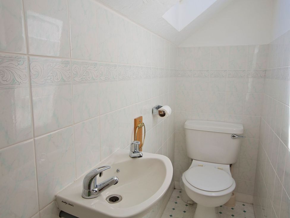 A bathroom with a sink and toilet at 3 Moult Farm Cottages in Salcombe