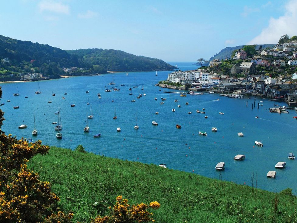 A view of a bay with boats and houses at 3 Moult Farm Cottages in Salcombe