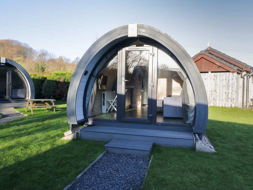A pod structure with glass door and furniture at Pod 7 (Pet Friendly) Tewitfield
