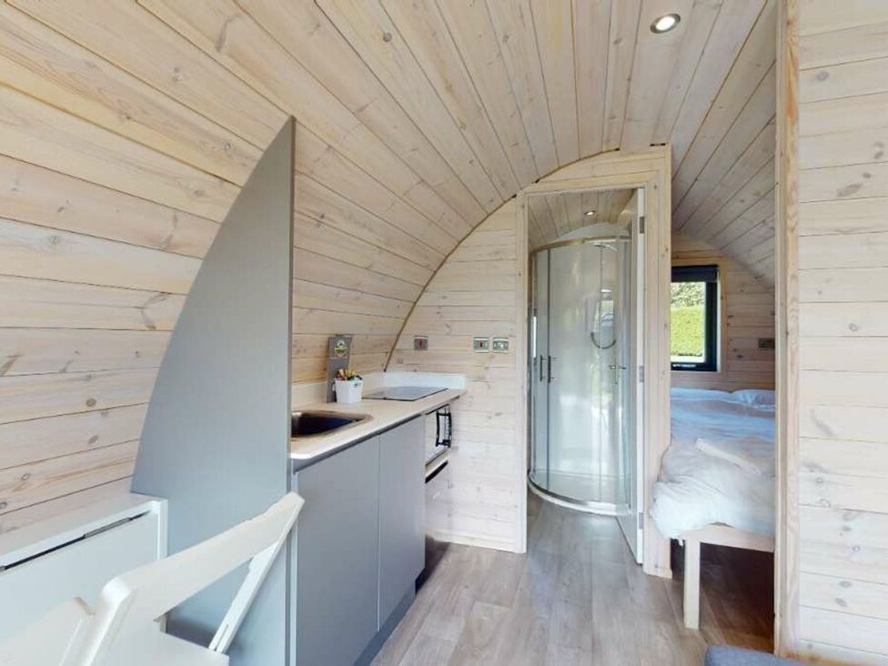 A kitchenette and shower within a pod at Pod 9 (No Pets) in Carnforth