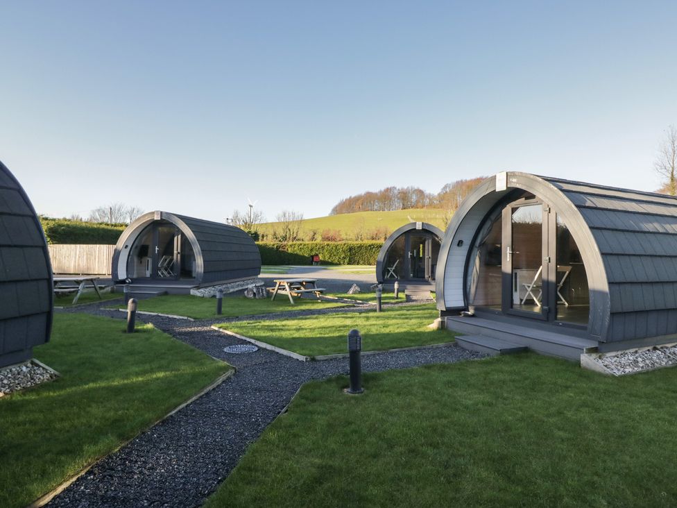 Three glamping pods with outdoor seating at Pod 9 (No Pets) Tewitfield near Carnforth