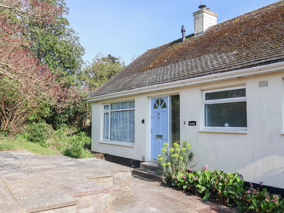 An exterior view of a house with a front door and plants at Fluta in Seaton