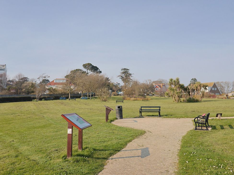 A park with benches and information boards at Fluta Seaton