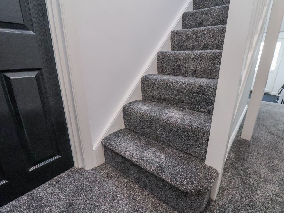 Stairs with carpet leading up to upper level at 2 bed Scarborough