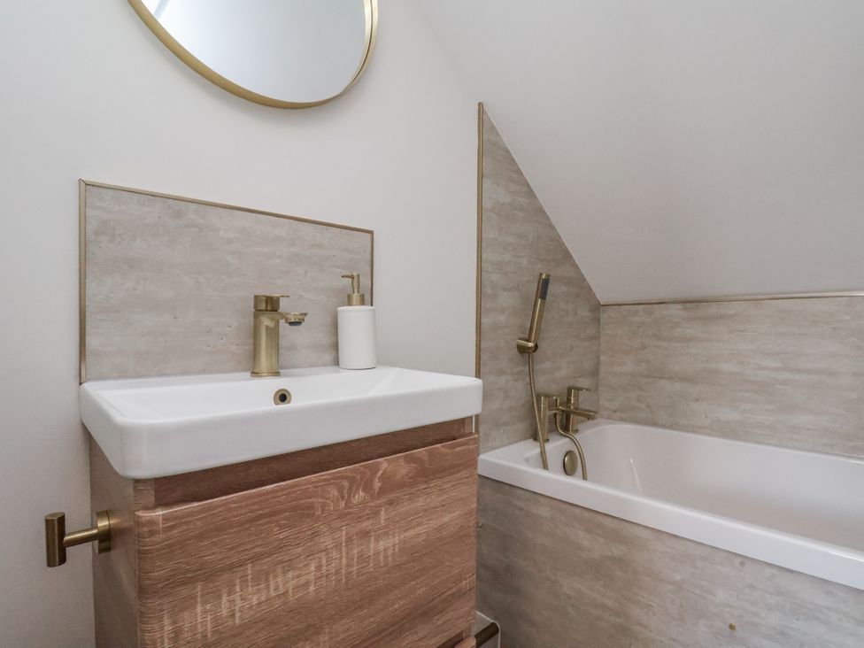 A bathroom with a sink and bathtub at 2 bed Scarborough