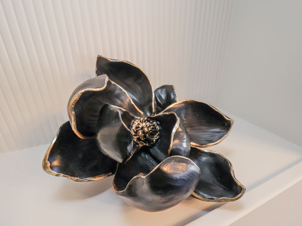 A decorative black flower sculpture at 2 bed in Scarborough