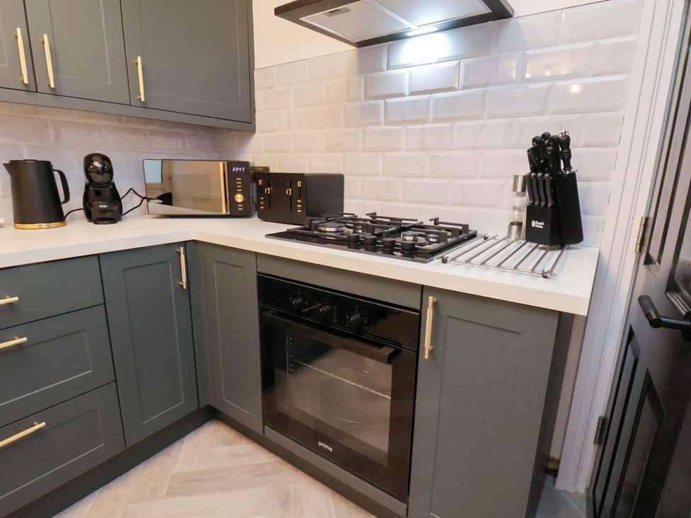 A kitchen with appliances and countertops at Maxwell View in Scarborough