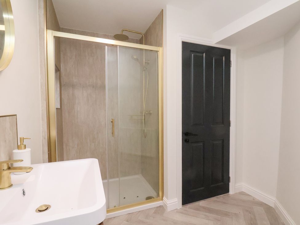 A bathroom with a shower and sink at Maxwell View in Scarborough