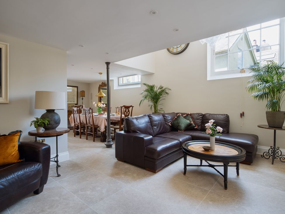 A living room with a sofa and table at The School House in Newton Abbot