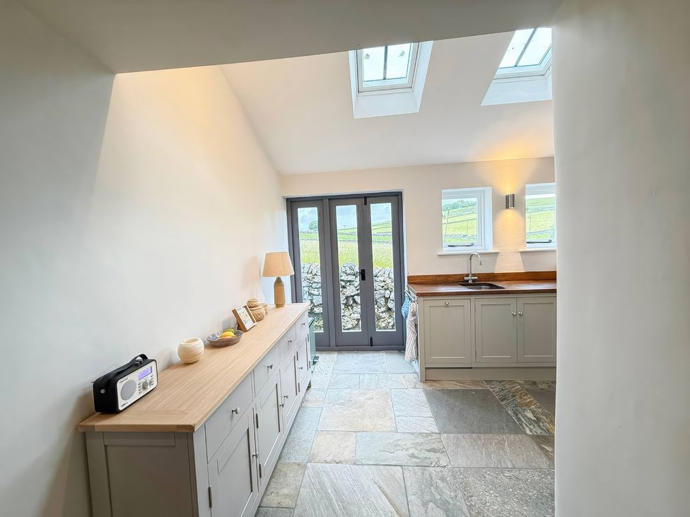 A kitchen with storage and sink at 7 Litton Slack in Tideswell