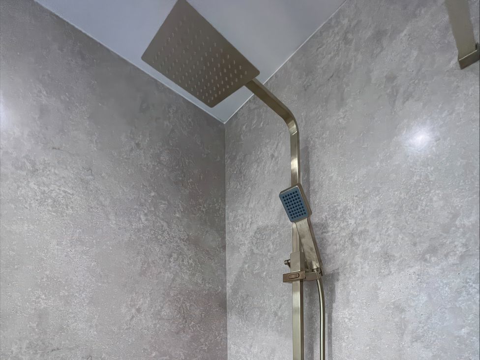 A shower setup with a rainfall shower head at 81 Lon Gogarth Benllech