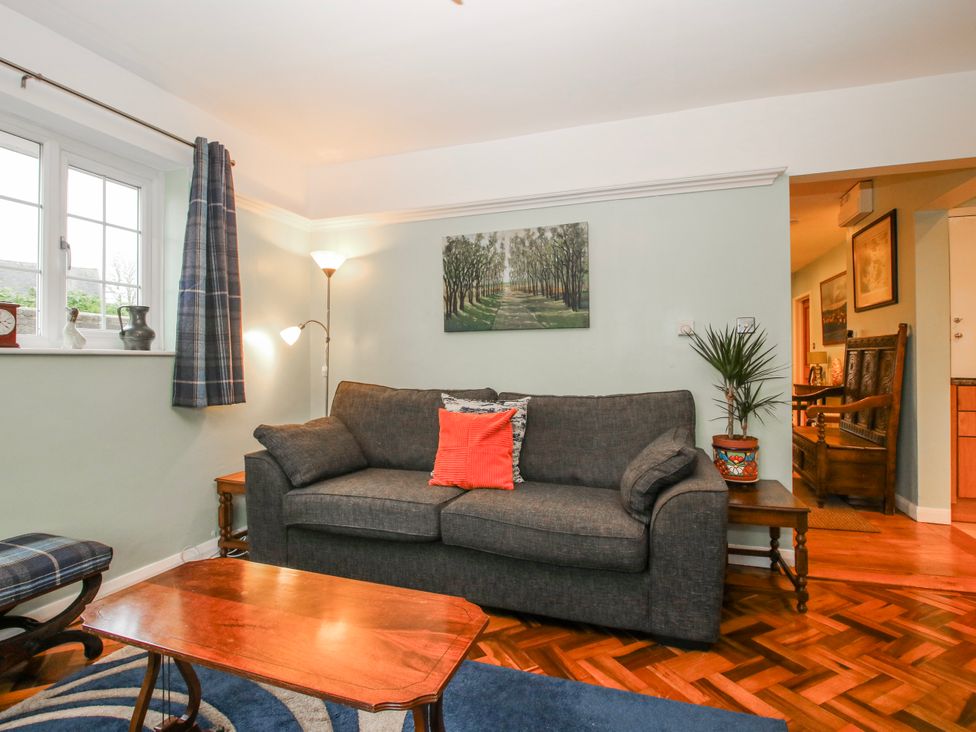 A living room with a sofa and coffee table at The Rumbles in 