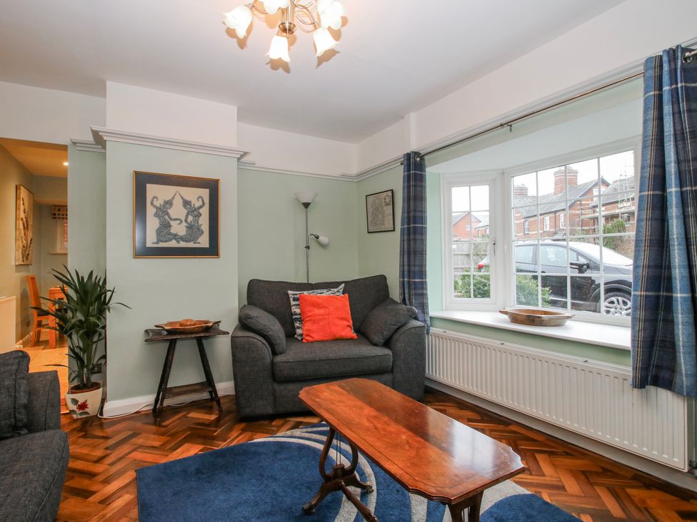 A living room with a sofa and coffee table at The Rumbles in 