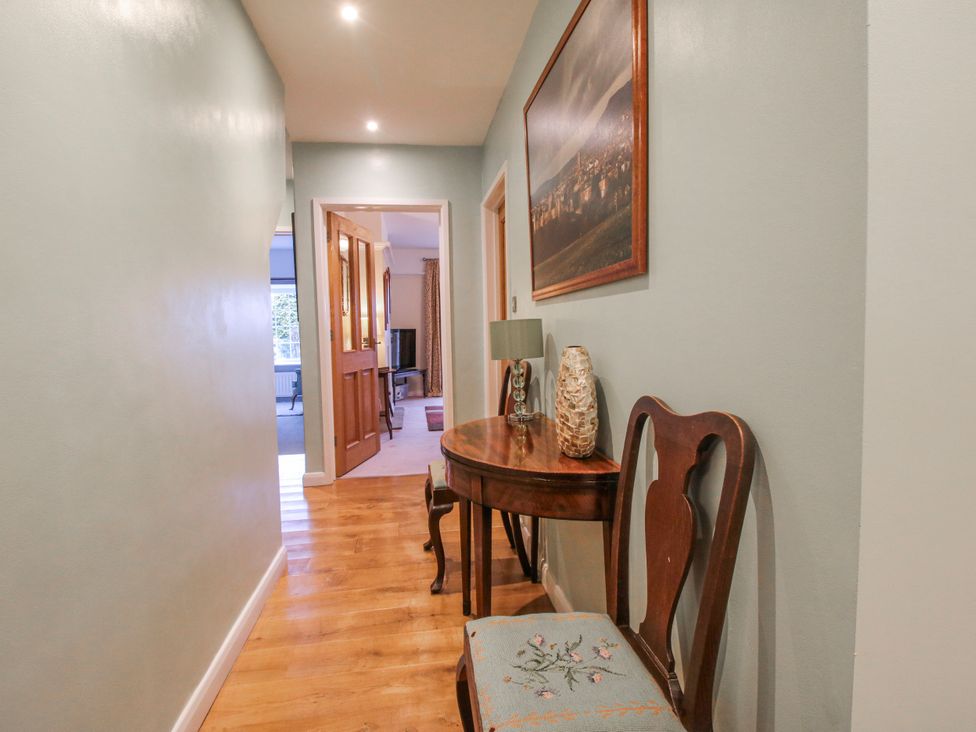 A hallway with a table and chair at The Rumbles